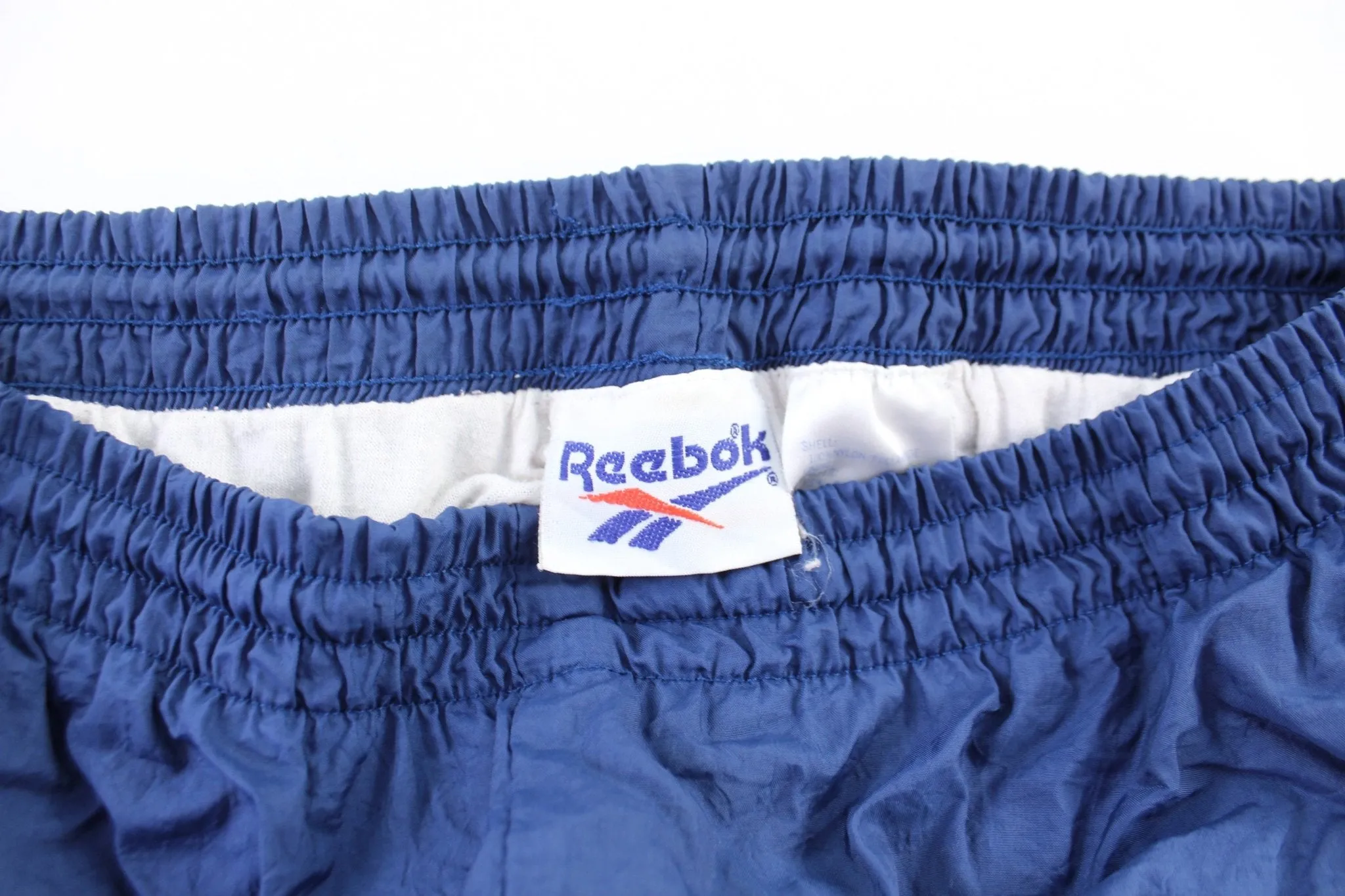 Vintage Reebok Embroidered Logo Navy Blue Windbreaker Pants